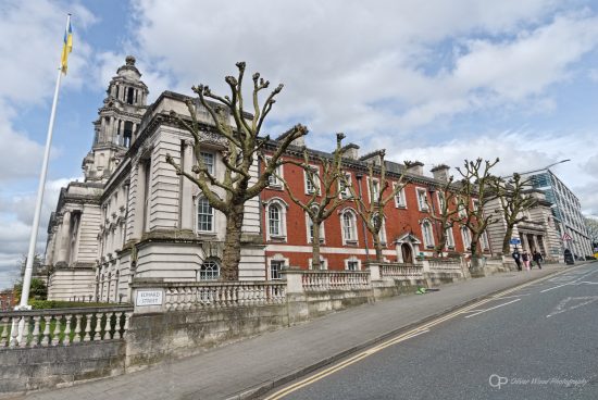 Photo of Stockport town hall with pollarded trees in front